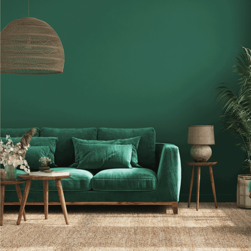 Home interior background with green sofa, table and decor in living room
