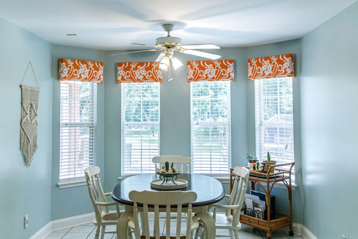 Light Blue Eat In Dining Room next to the kitchen with a tile floor, table and chairs