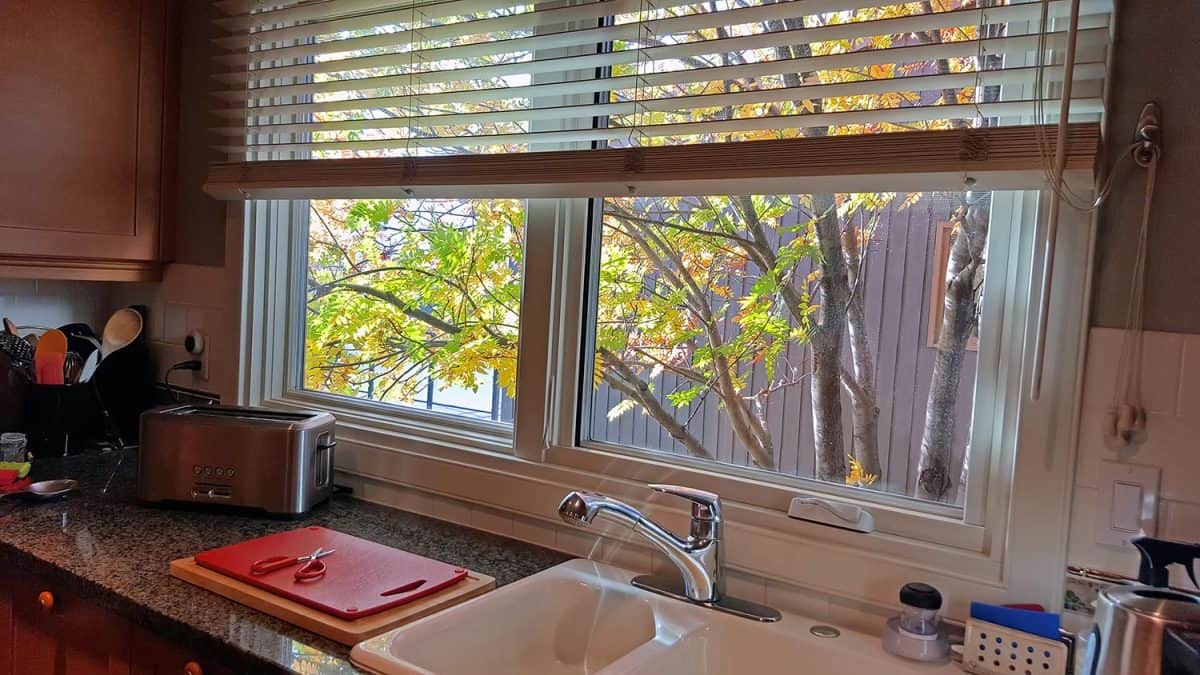Residential kitchen with an autumn view window