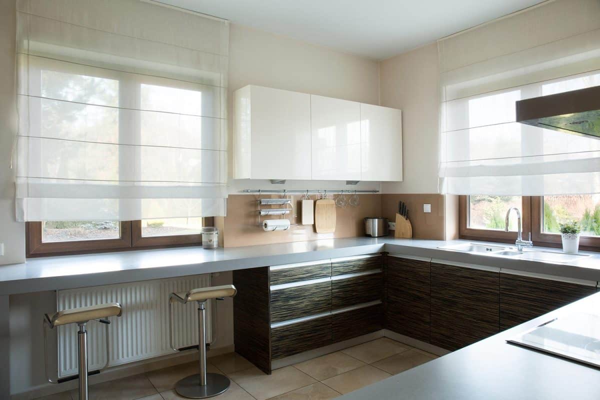 White and brown kitchen interior in traditional style
