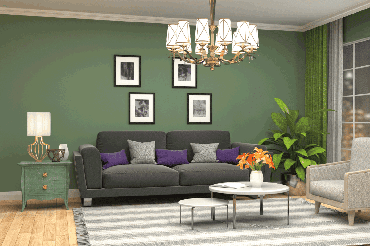 modern house living room with green walls with portraits, black couch