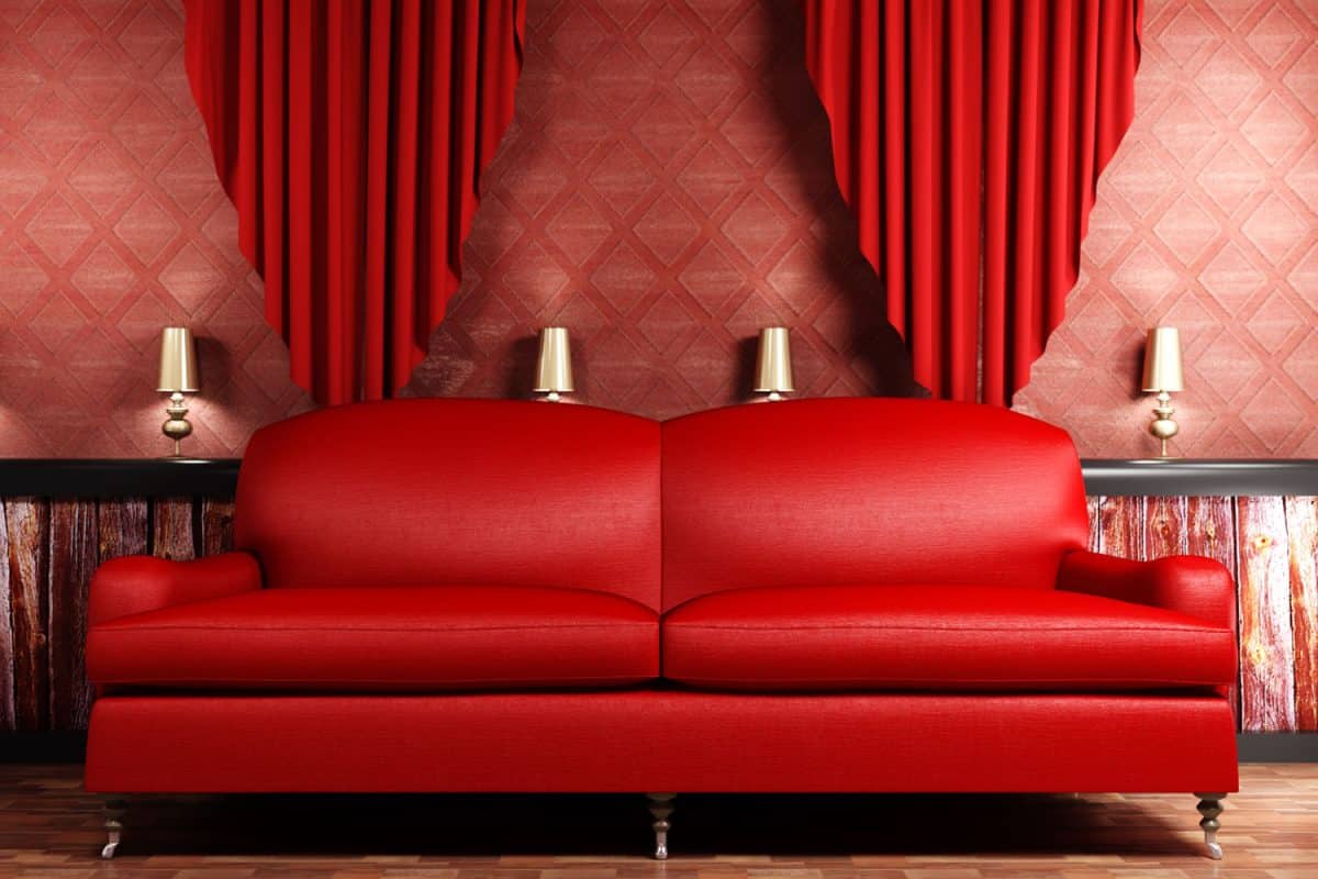 A red leather loveseat sofa