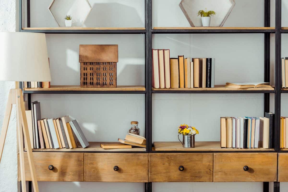 A tall metal and wooden combined bookcase