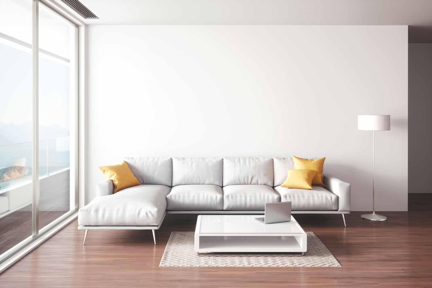 A white sectional sofa with yellow throw pillows inside a wooden laminate living room, What Color Couch With Light Gray Walls?