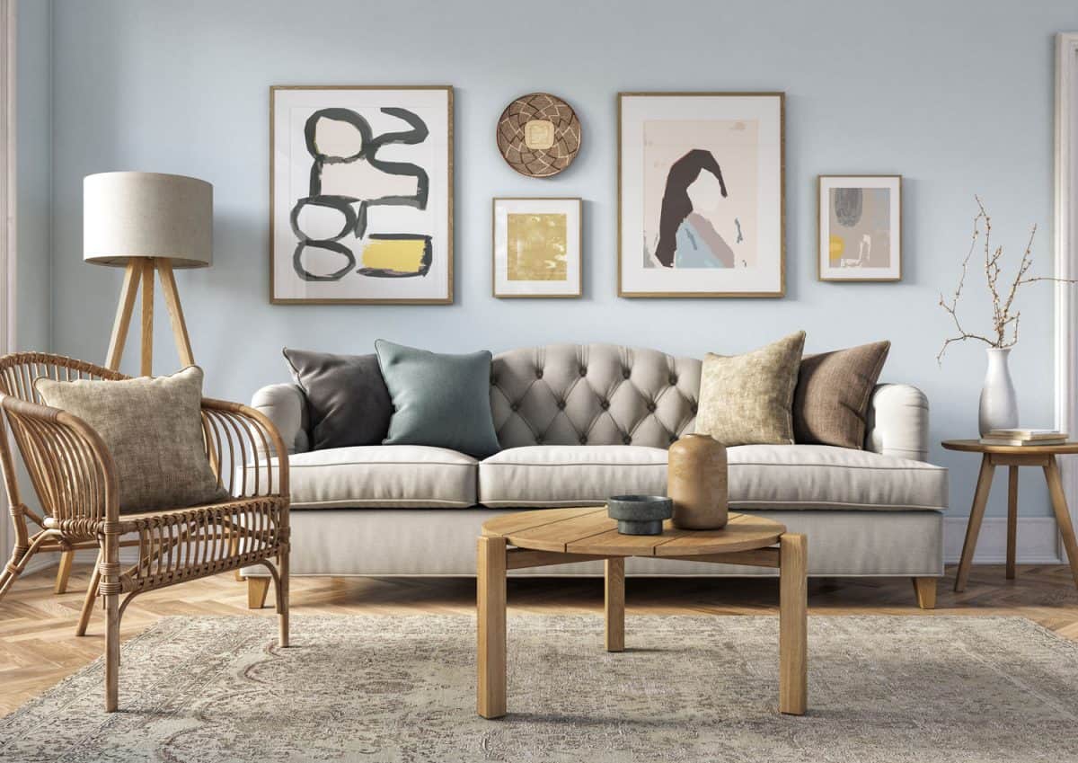 Bohemian living room interior 3d render with beige colored furniture and wooden elements and light blue colored wall