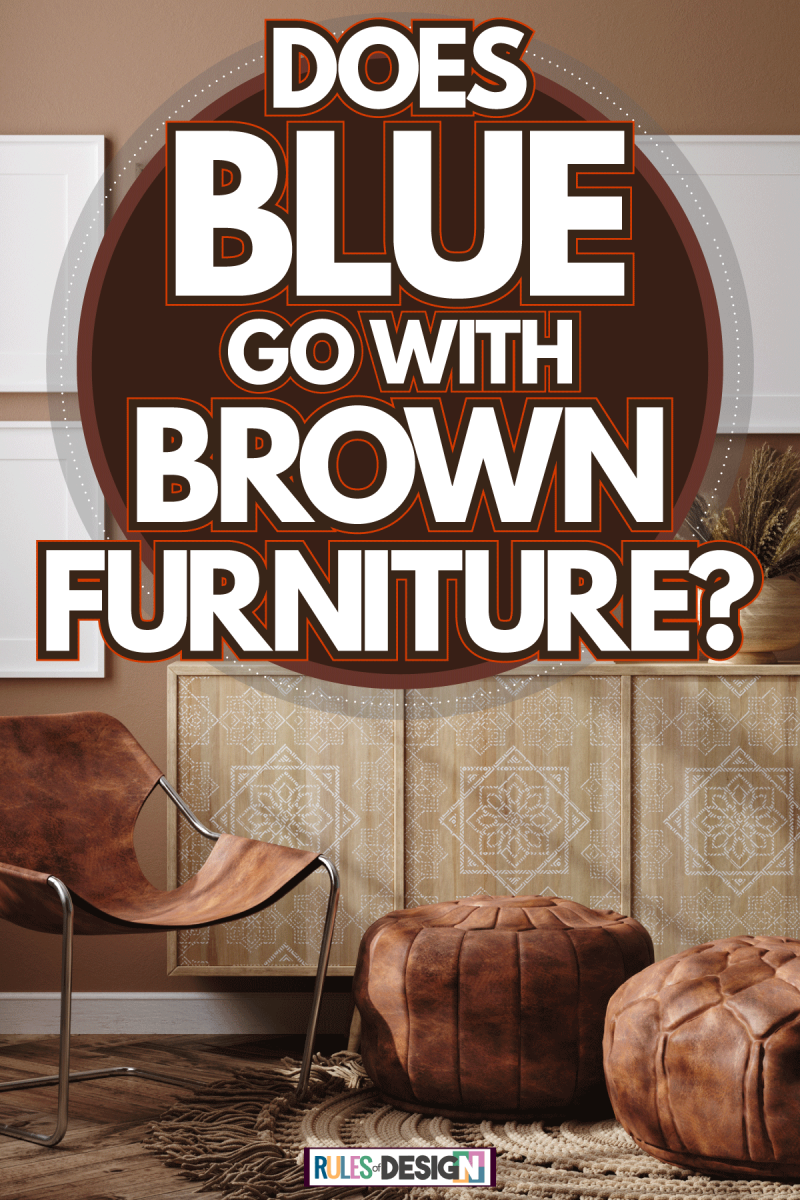 A brown inspired living room with brown leather ottoman and empty white canvas, Does Blue Go With Brown Furniture?