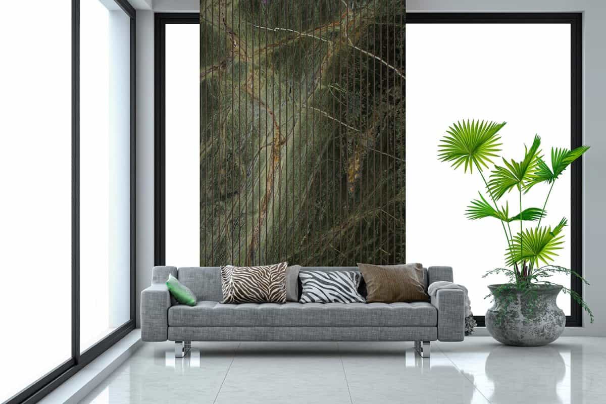Elegant living room with gray sofa on gray marble tiled floor in front of a natural green ang beige marble texture wall