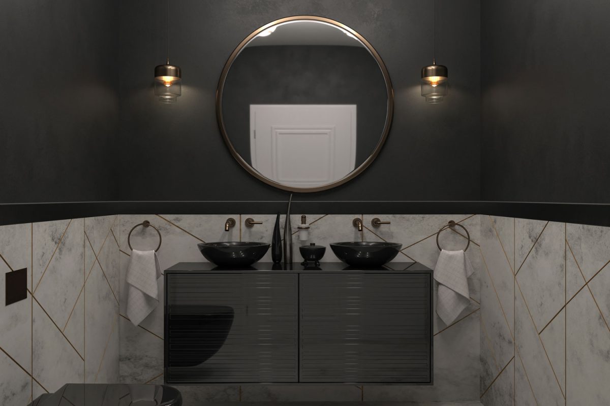 Interior of a contemporary black designed bathroom with a round mirror and a black paneled cabinet