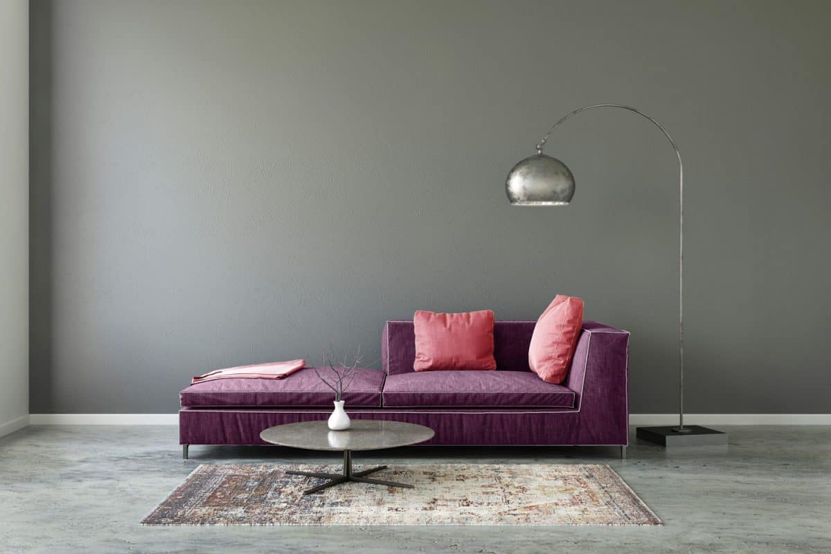 Interior scene with pastel colored sofa with colorful pillows - What Colors Go With Gray Walls?