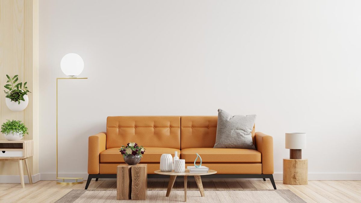 Living room interior wall mockup in warm tones with leather sofa