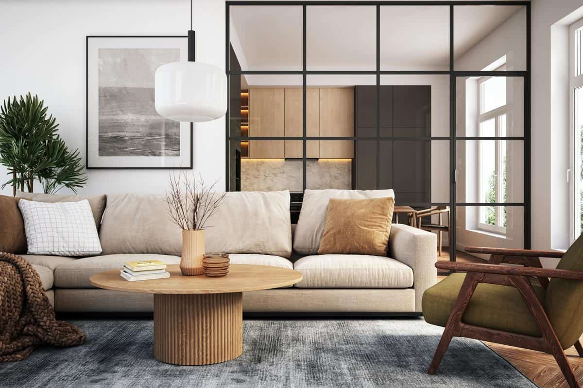 A living room with beige couch and wooden furniture, What Color Couch Goes With Gray Carpet?