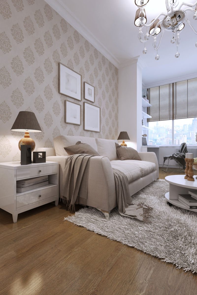 Luxurious modern condominium with floral beige wallpaper matching the sofas and rug