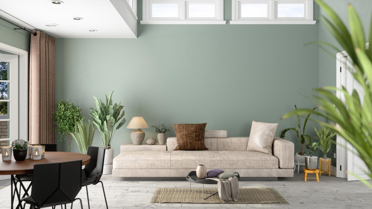 Modern living room interior with green plants, sofa and green wall