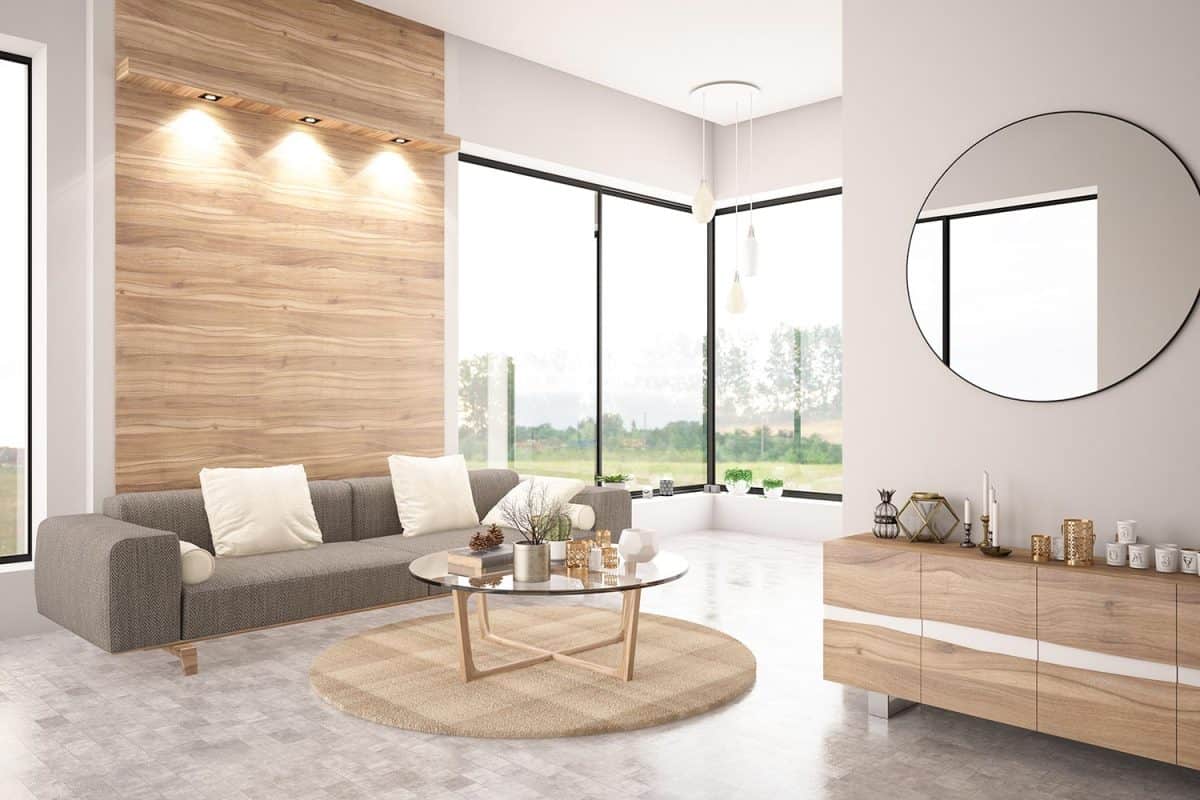 Modern living room interior with sofa and circle mirror