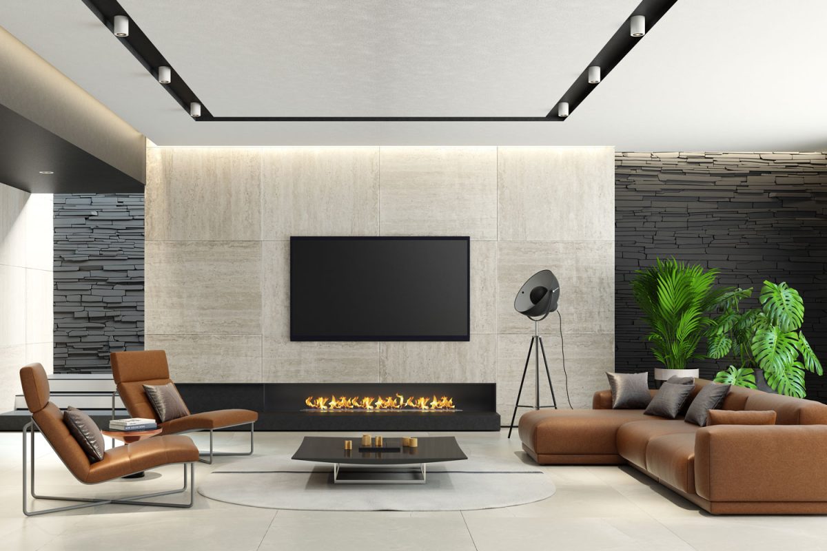 Sectional leather sofas with a gorgeous gray tile paneling on the TV and fireplace
