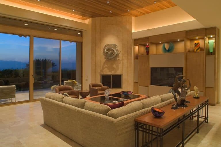 A spacious and luxury living room with scenic view through windows, 11 Best Paint Colors For A Low-Light Living Room