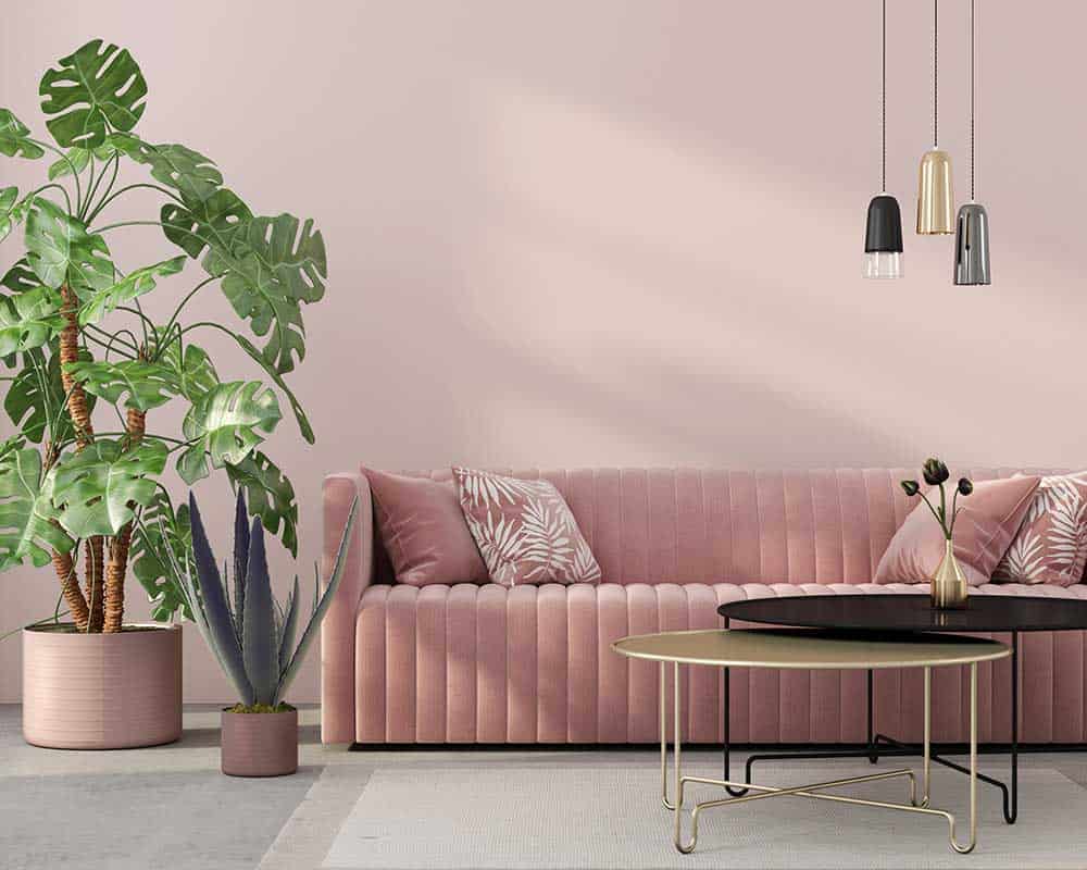 Stylish living room interior in pink with a concrete floor