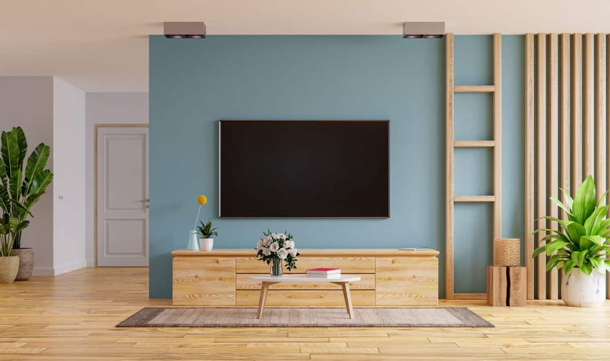 TV LED on the cabinet in modern living room on blue wall background