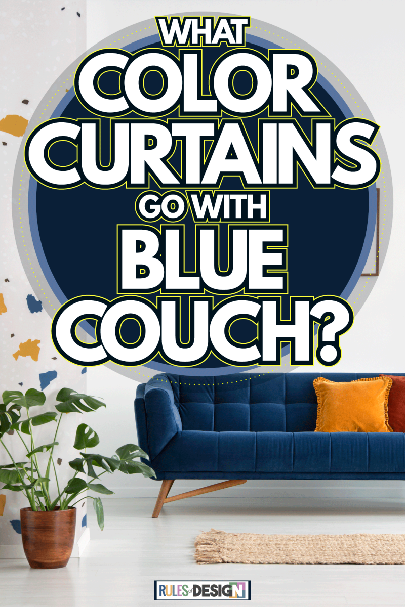 A blue sectional couch with a yellow throw pillows inside a white living room, What Color Curtains Go With Blue Couch?