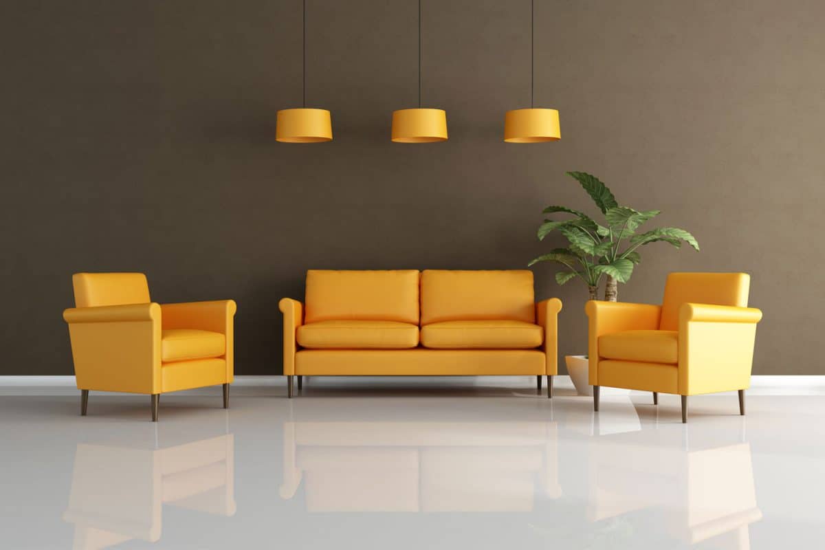 Yellow colored sofas with yellow dangling lamps