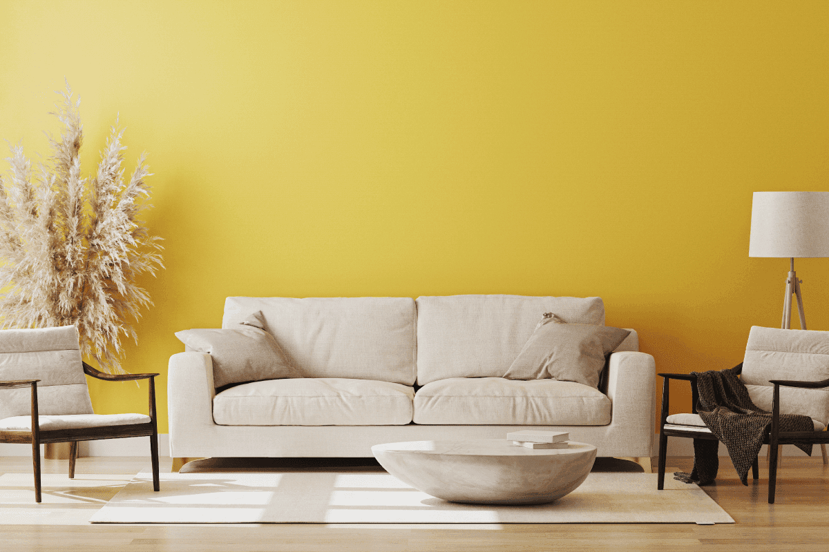 yellow living room with beige couch and arm chairs, eccentric coffee table. What Color Couch Goes With Light Yellow Walls