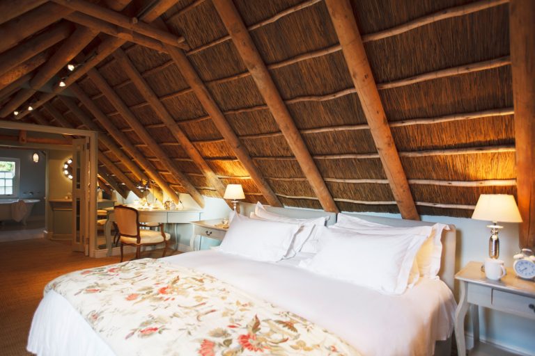 A beach house constructed from wooden logs and cogon grass serving as roofing for the small rest house, 10 Best Sloped Ceiling Recessed Lighting Options