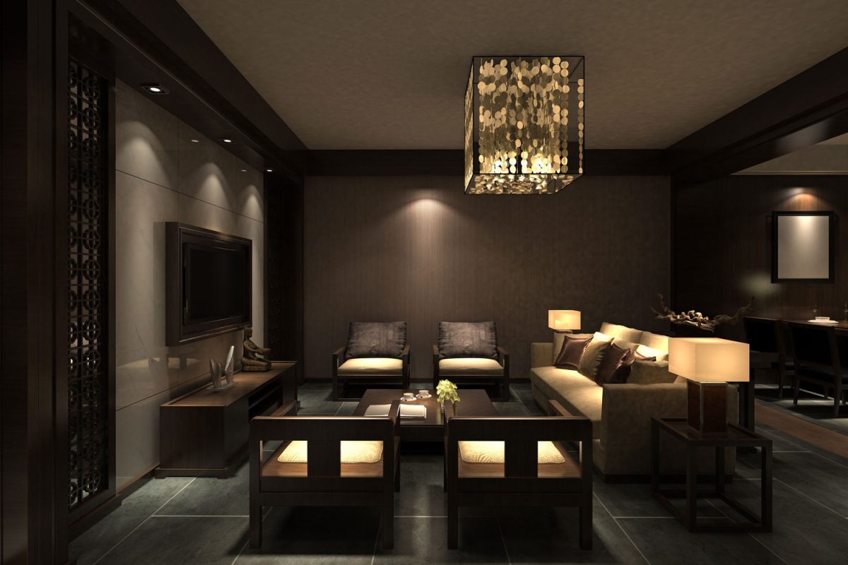 A dark living room with dark walls with wooden paneling and matched with wooden furnitures