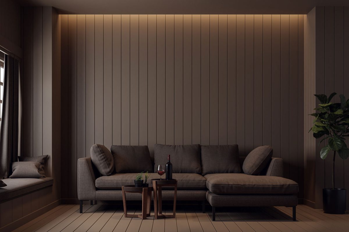 A dark wooden wall paneled living area with a matching brown sofa and wooden coffee tables