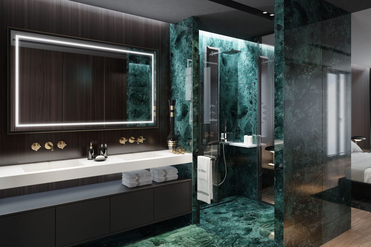A gorgeous deep emerald bathroom with a minimalist vanity and a huge mirror