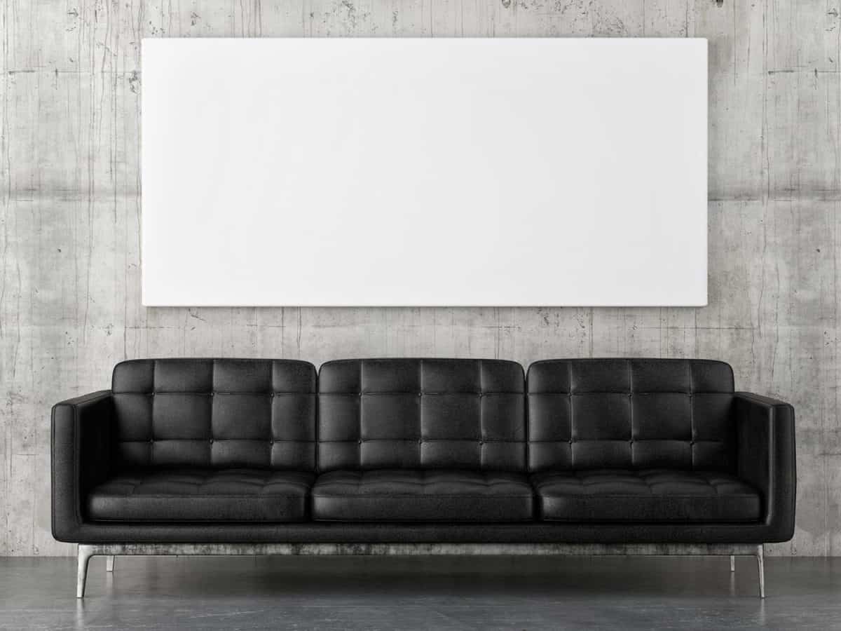 Black leather sofa with horizontal mock up poster