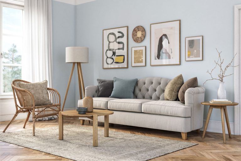 Bohemian living room interior with beige colored furniture and wooden elements and light blue colored wall, What Pillows Go With A Gray Couch?