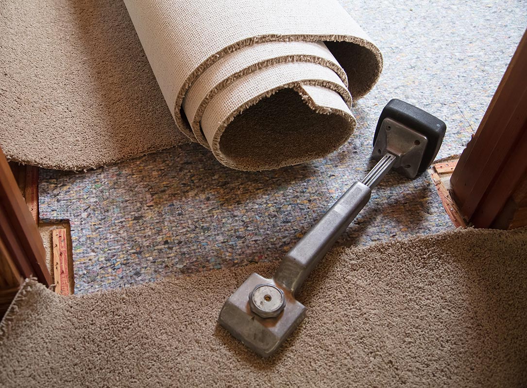 Carpet knee kicker by carpet and padding in home