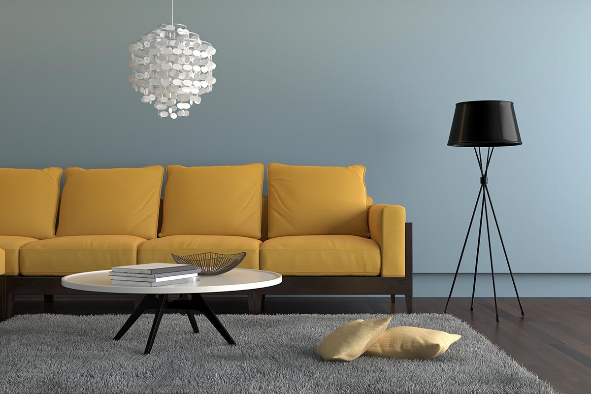 Contemporary living room with yellow sofa with light blue wall