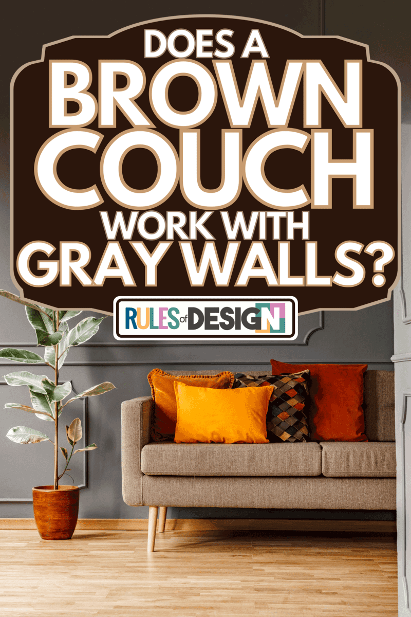 Brown couch with orange pillows in dark grey apartment, Does A Brown Couch Work With Gray Walls?