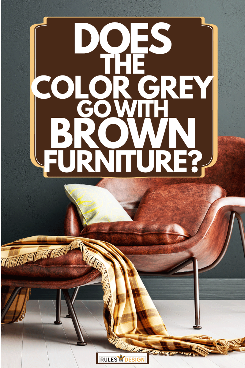 simple living room with drak grey interior with cognac brown leather arm chair, the color grey go with brown furniture?
