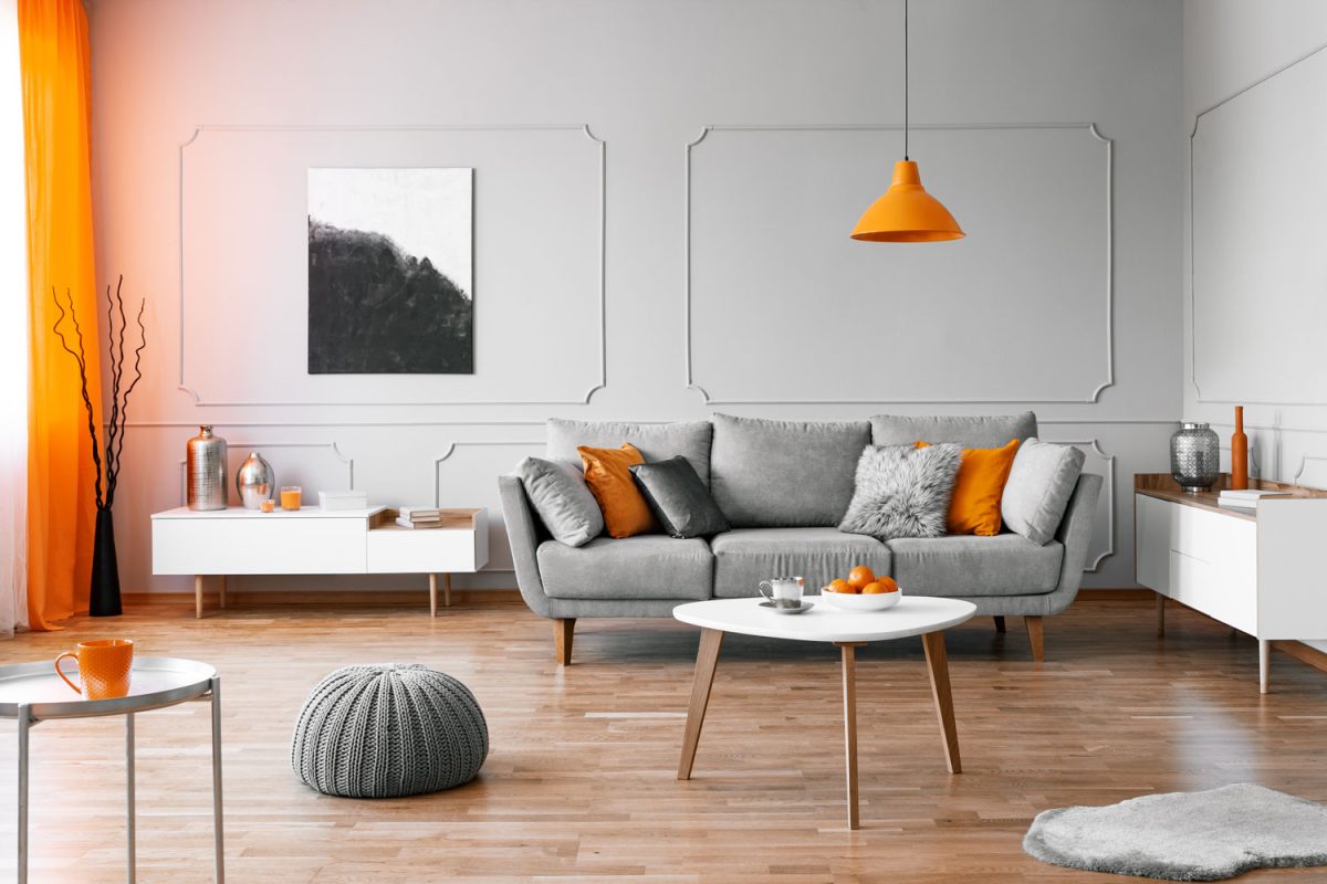 Funky and retro style of living room with color combo of orange and gray