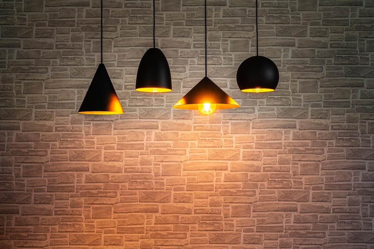 Illuminated pendant lamps and brick wall