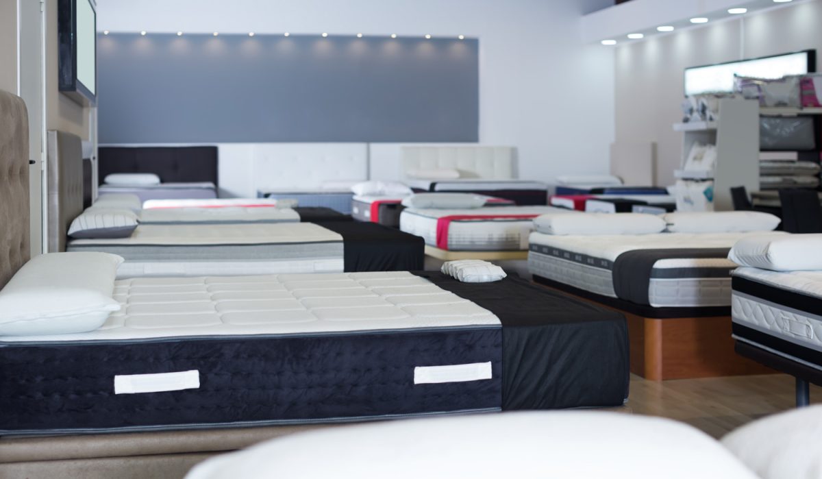 Image of new mattresses on the beds in the mattress store
