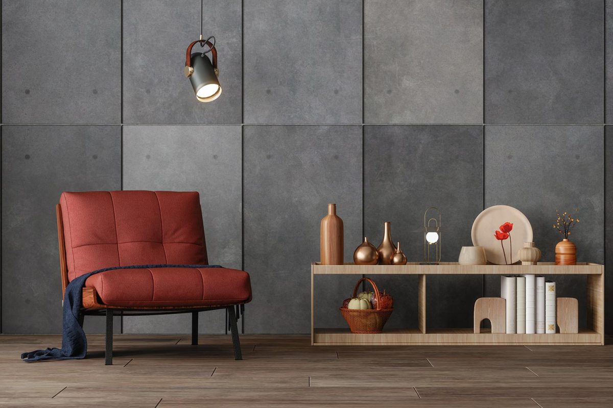 Interior of modern living room with red armchair with gray colored wall and parquet floor