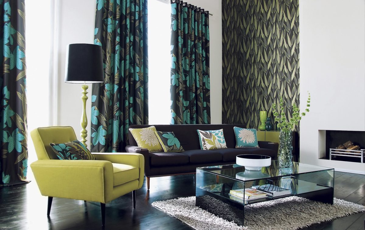 Interior of stylish sofa, chair, curtains and ornaments in a modern livingroom
