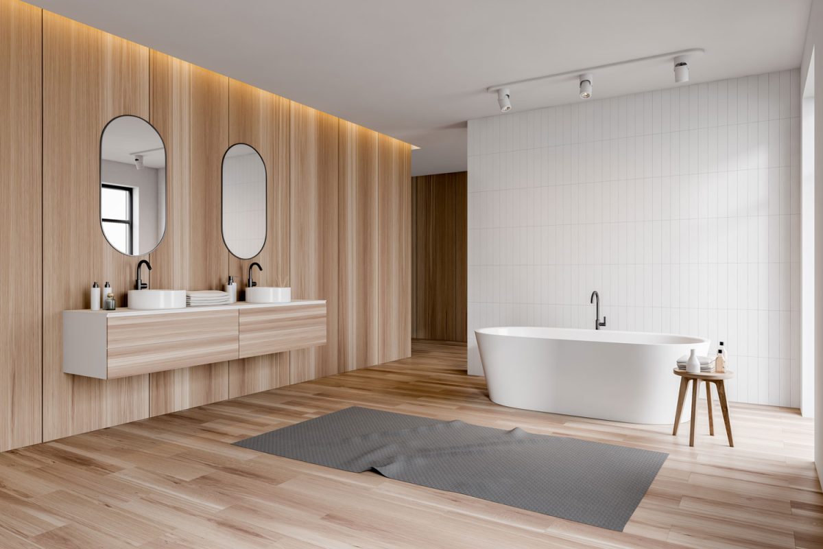 Lavish rustic bathroom with laminated walls and flooring with round mirrors and a white bathtub