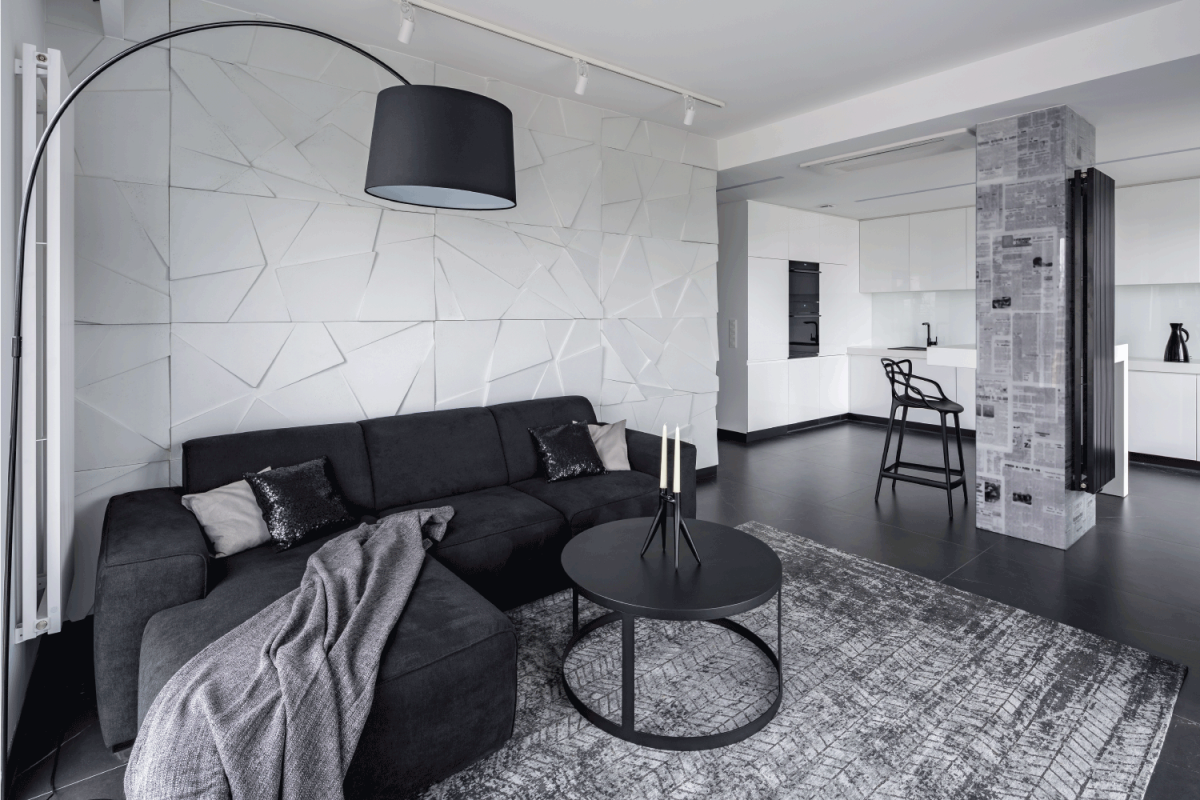 Living room and kitchen in open space modern apartment. black gray and white concept