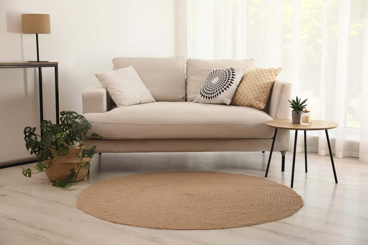 Living room interior with comfortable sofa and stylish round rug - How Big Should A Foyer Rug