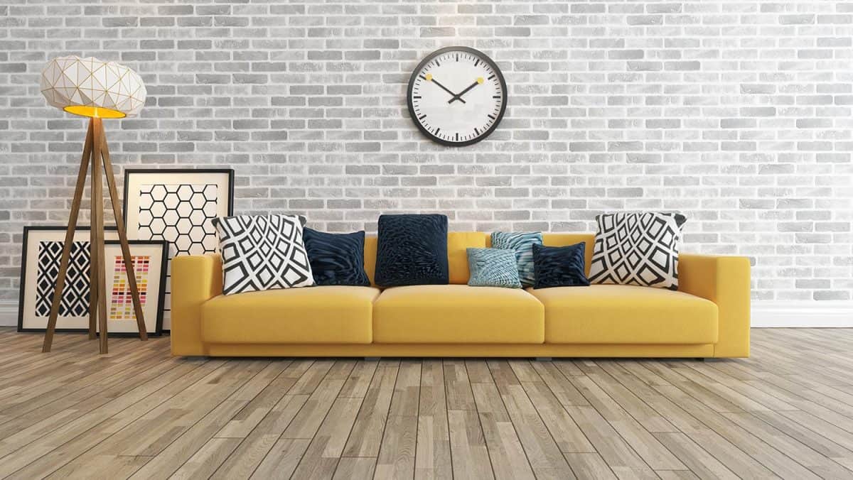 Living room with big watch white brick wall