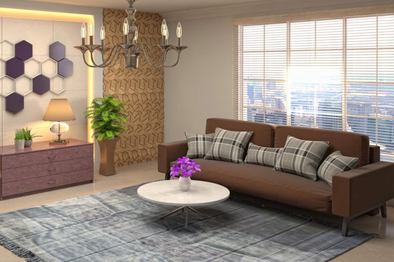 A living room with brown sofa and violet flower on white table, What Color Walls Goes Best With Brown Sofa?