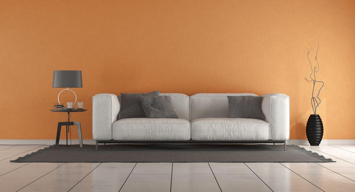 Living room with orange wall and modern sofa