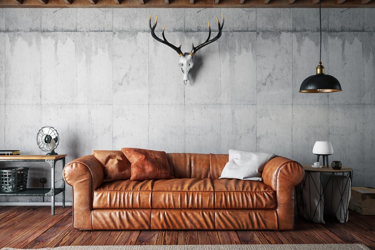 Loft interior with leather sofa and skull decoration