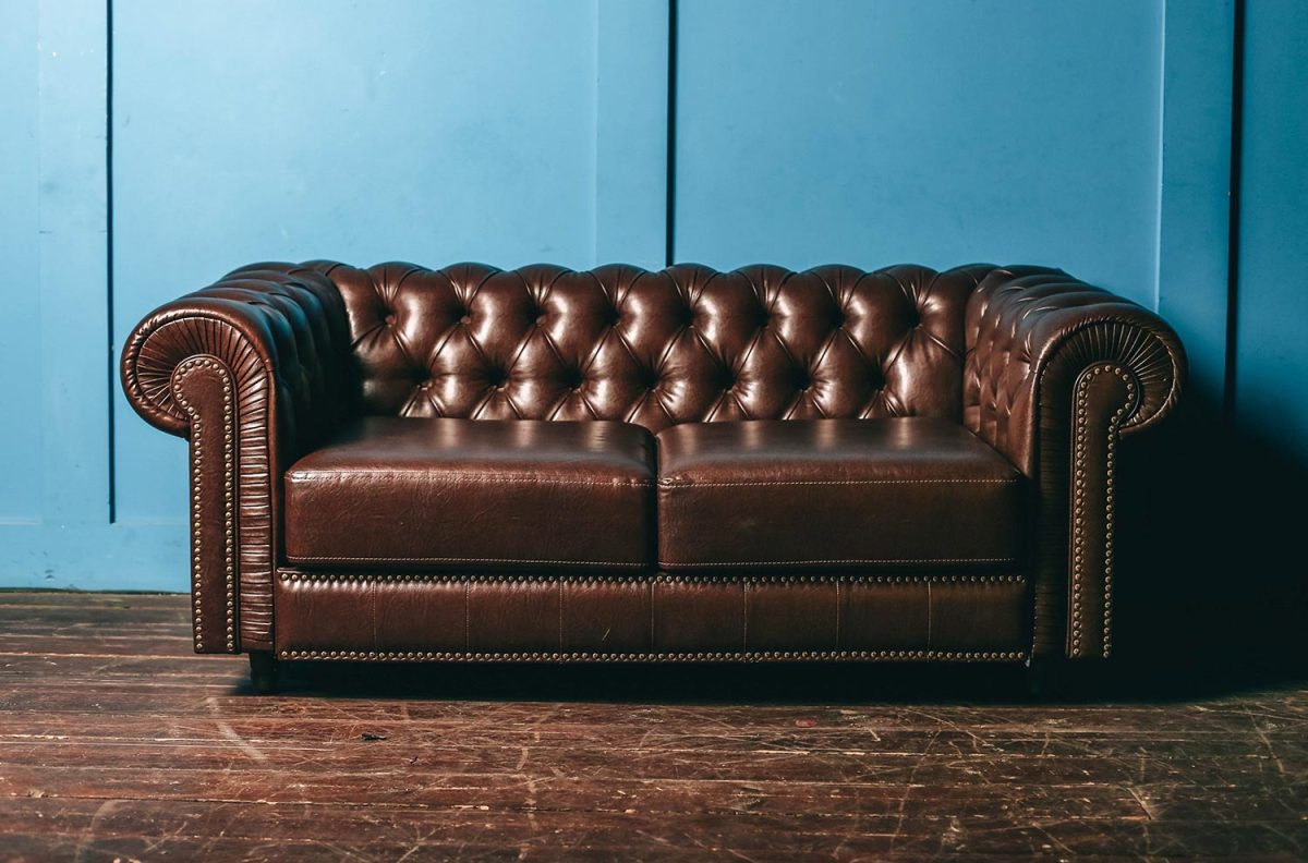 Luxurious brown leather sofa in blue wall