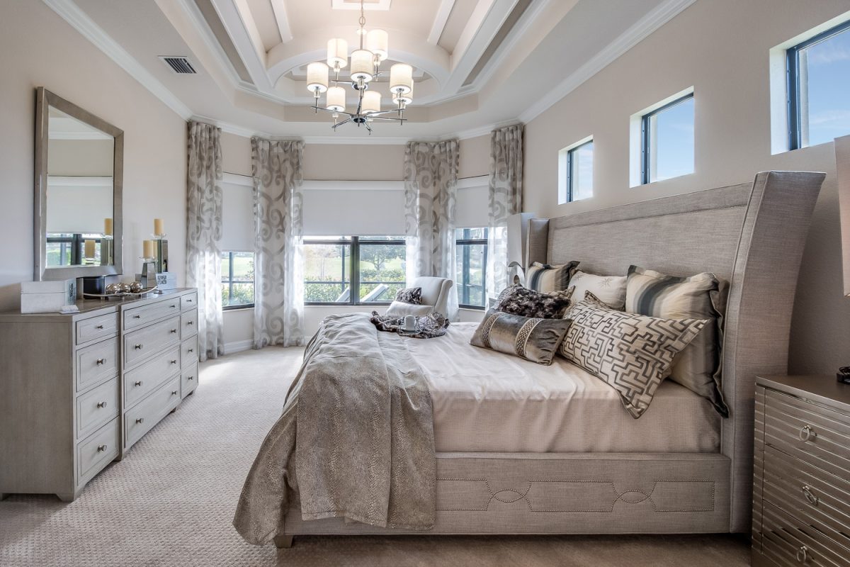 Many luxuries such as chandelier, coffered ceiling and reading nook in master bedroom

