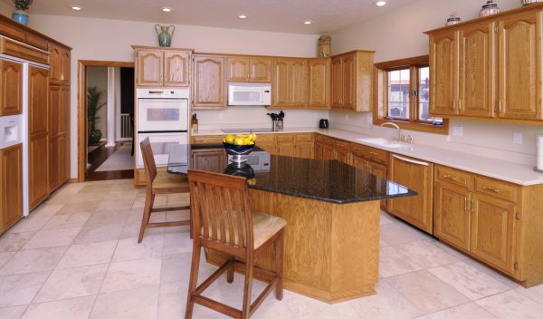 Modern Kitchen With Hardwood Cabinetry - What Color Floor Goes With Oak Cabinets